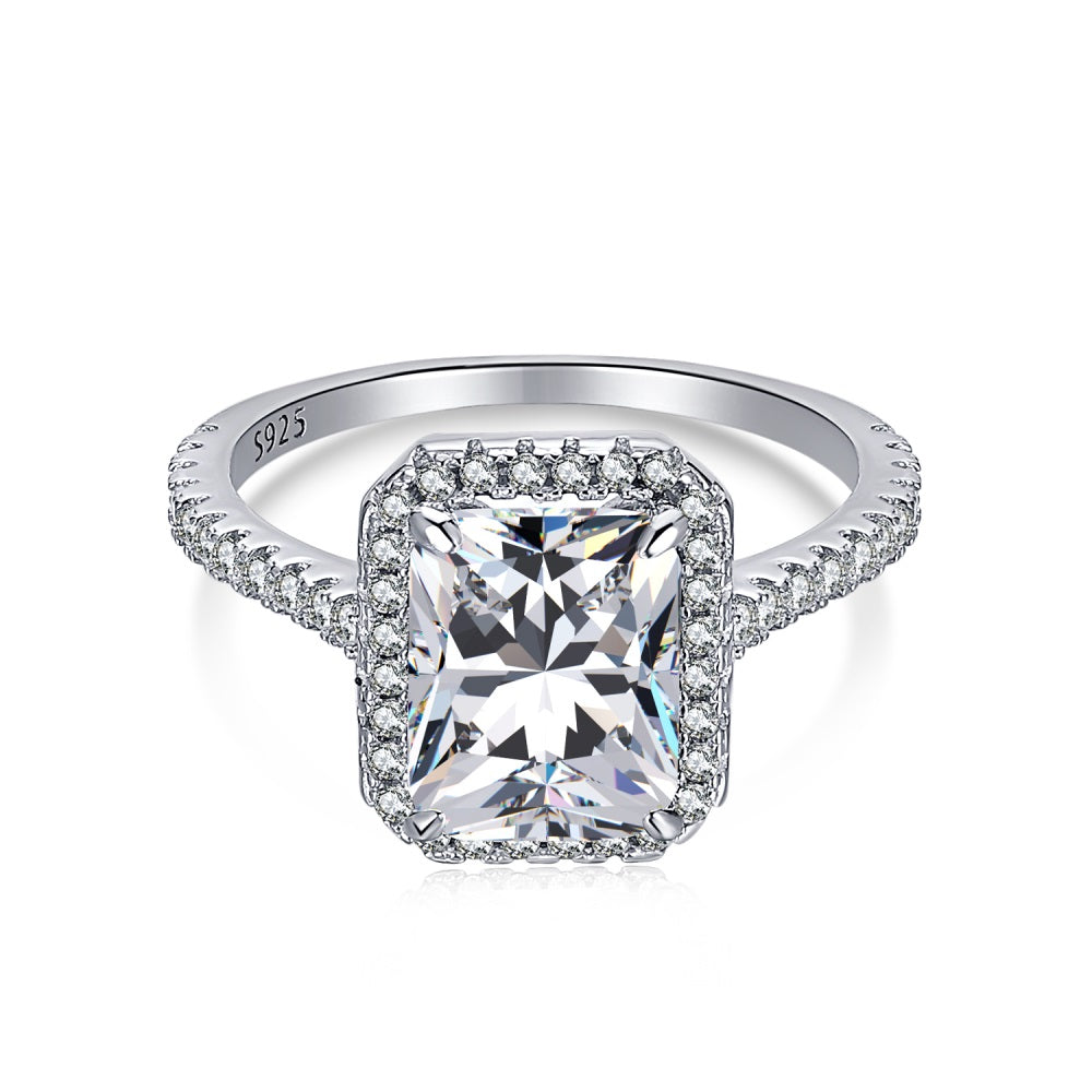 A 3.0 ct Aura Rectangle Radiant Ring with a white gold band and a clear, rectangular main stone surrounded by smaller round stones.