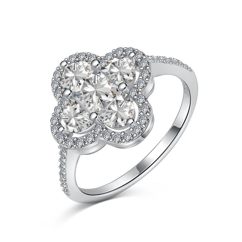 A silver clover-shaped ring with multiple clear gemstones and a rhodium plating.