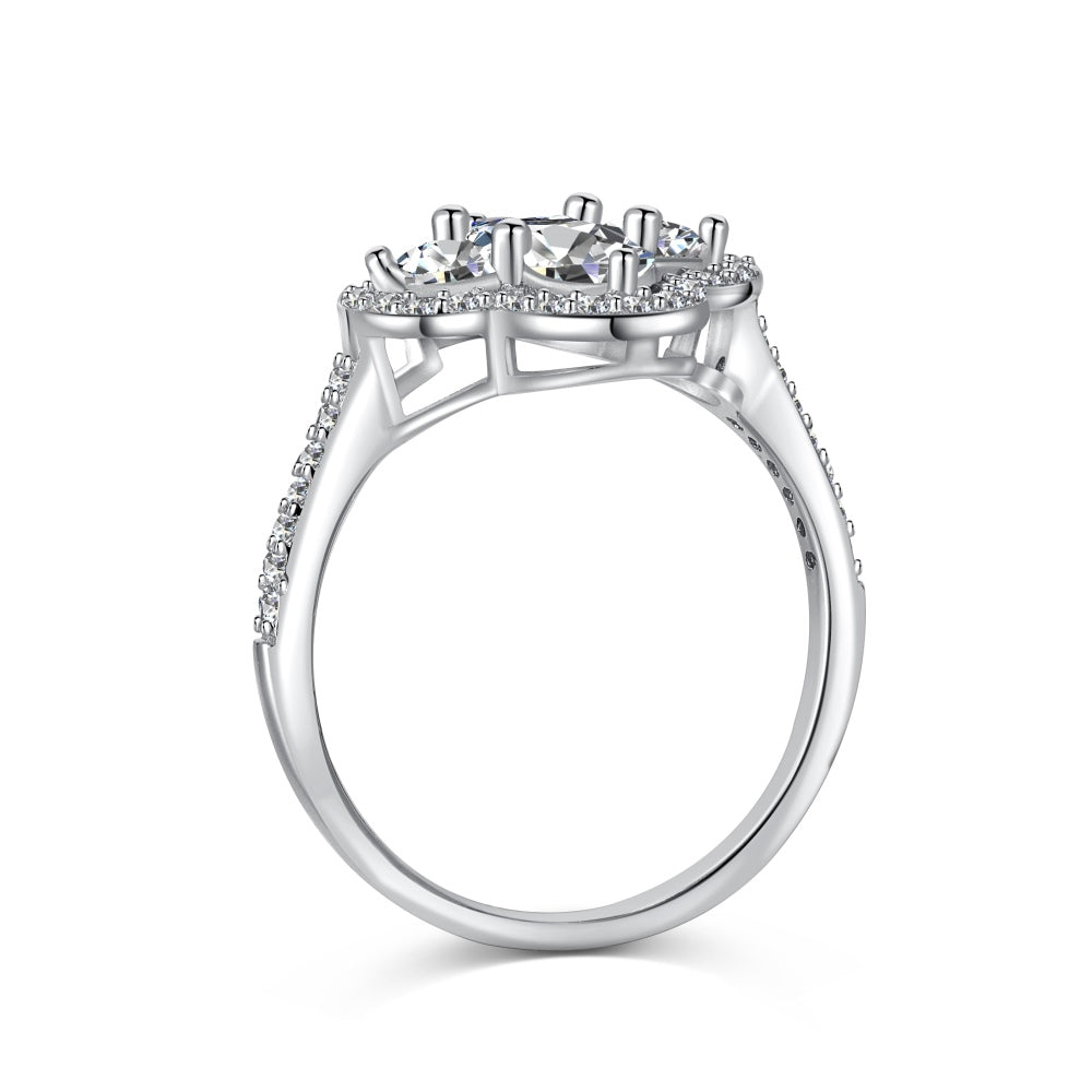 A silver clover-shaped ring with multiple clear gemstones and a rhodium plating.