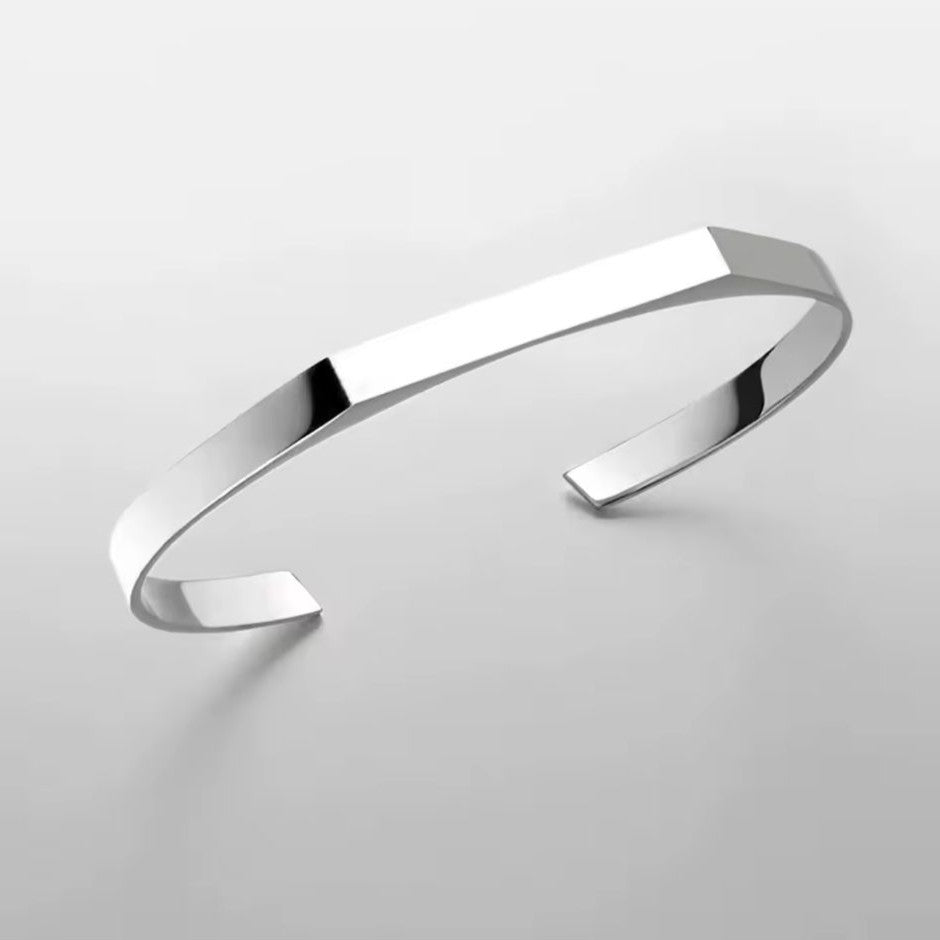 Silver bracelet on a light gray background