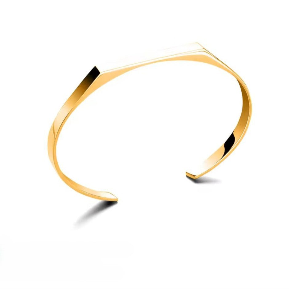 Gold bracelet on a white background