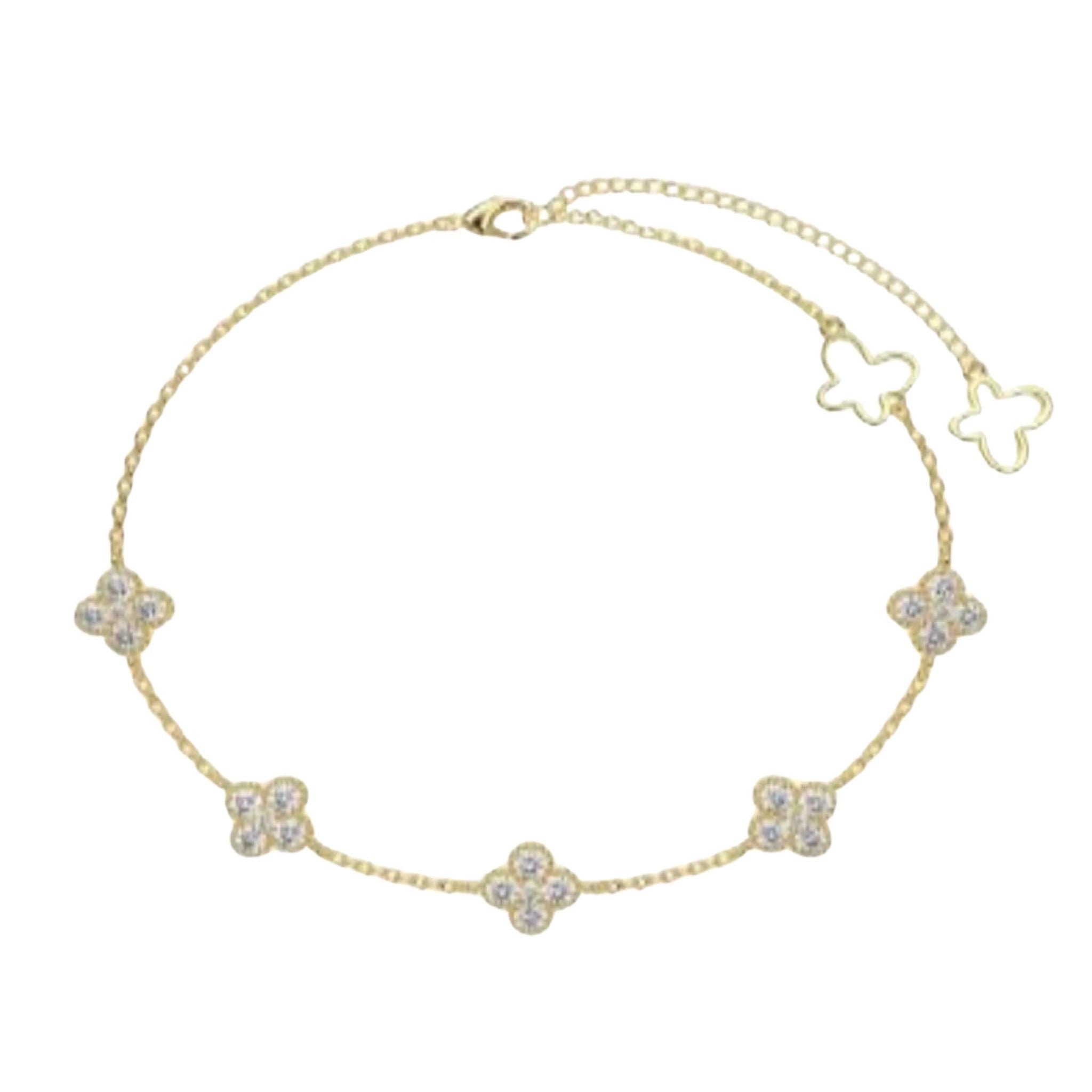 A gold-plated 925 sterling silver bracelet with a floral design, featuring small diamond-shaped stones.