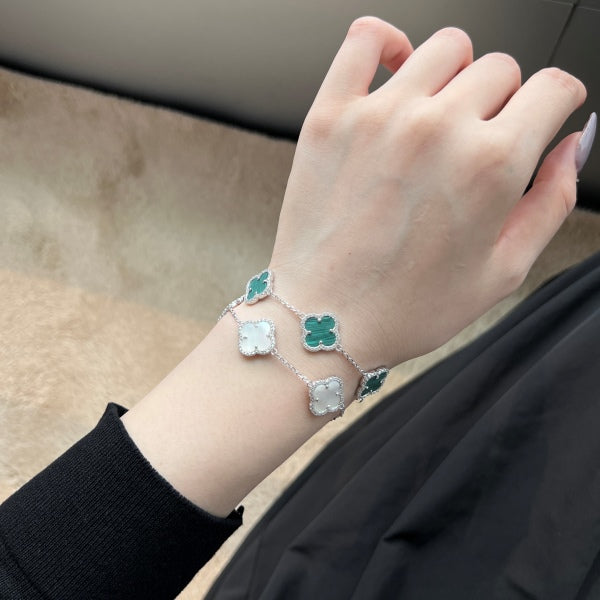 Elegant 925 sterling silver bracelets featuring clover designs with white and green shell accents with an adjustable chain.