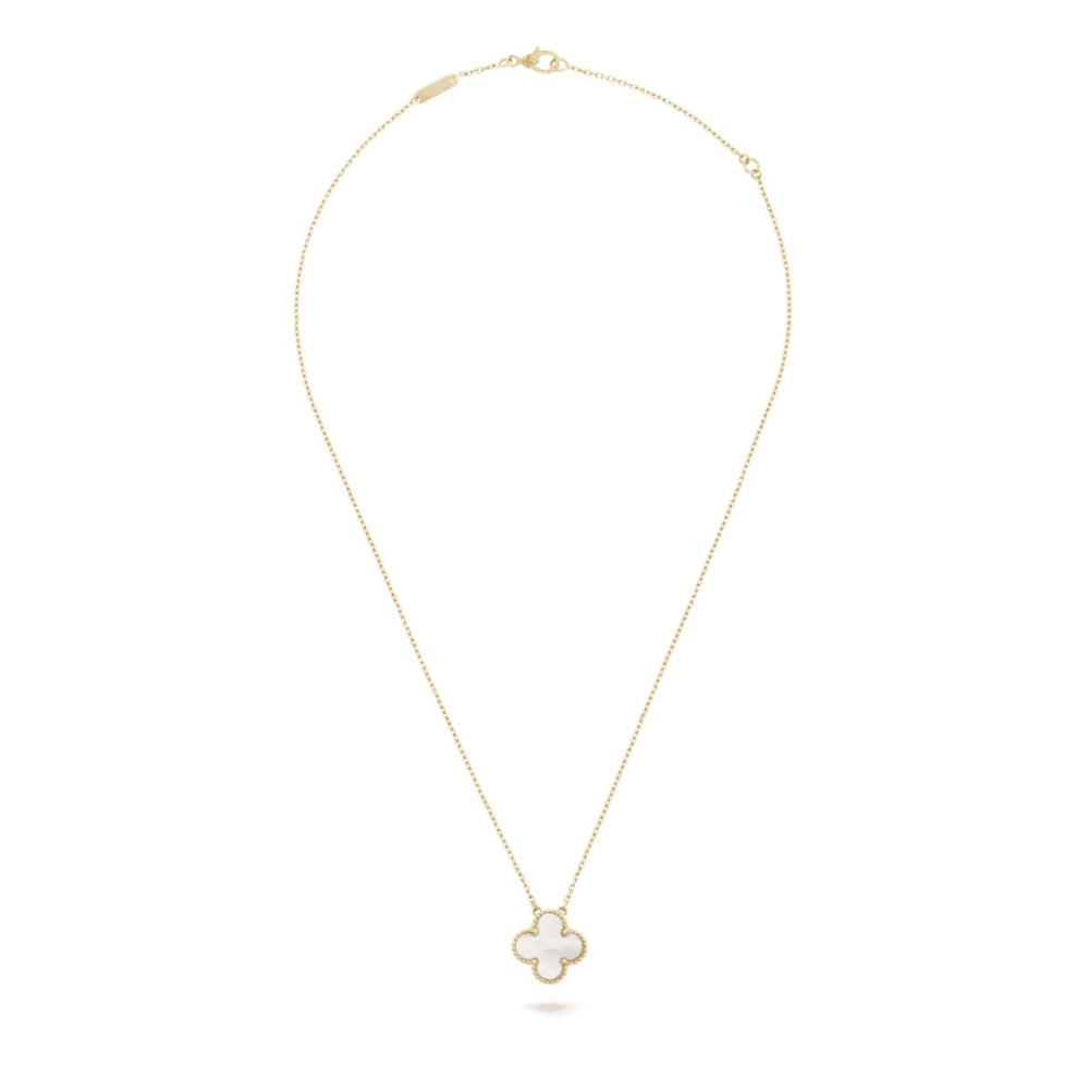 Gold necklace with a clover-shaped pendant on a white background