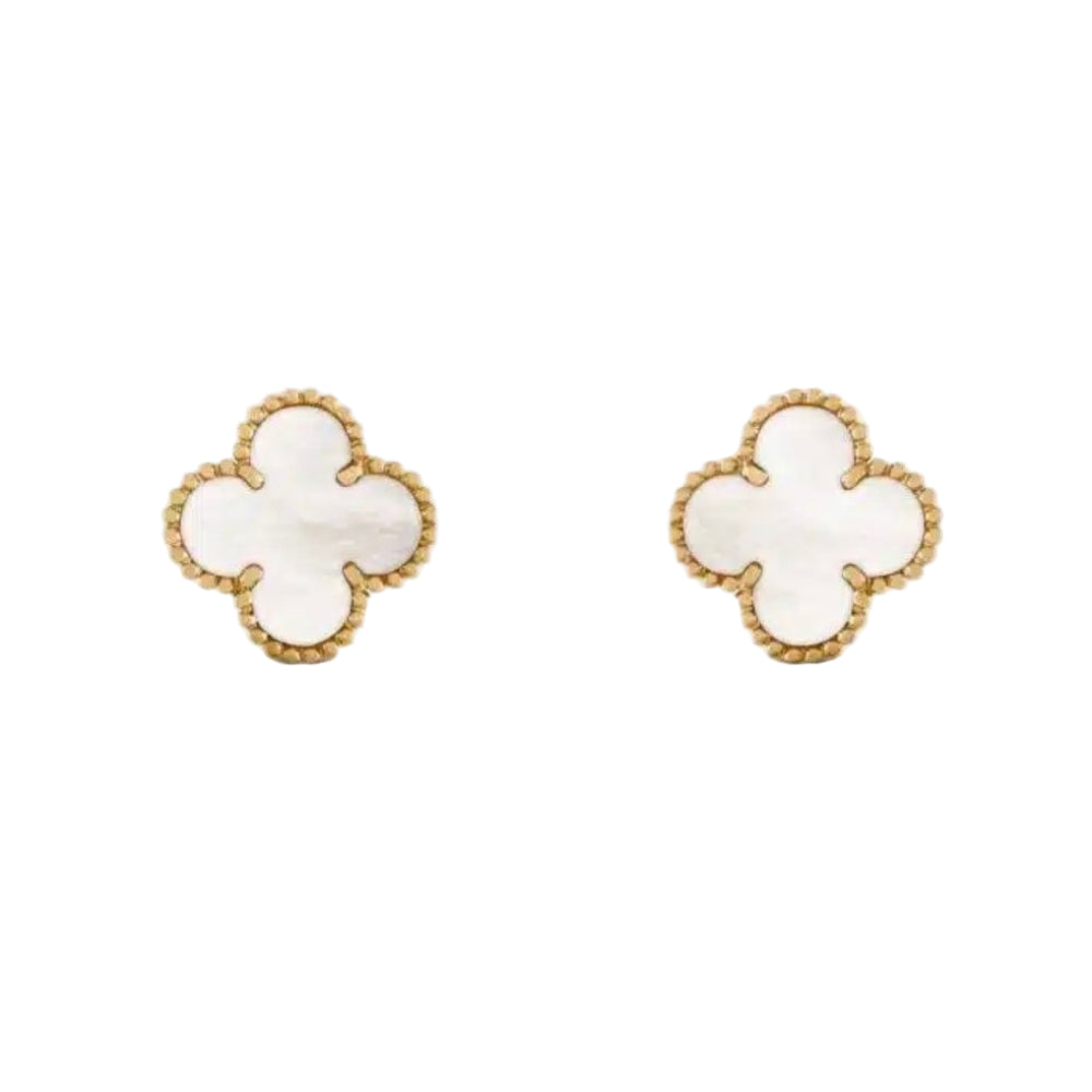 Pair of gold earrings with white clover-shaped stones on a white background