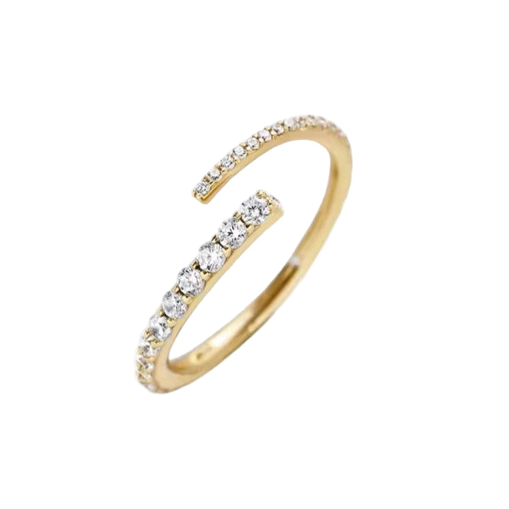 Adjustable open ended Gold ring with diamonds on a white background
