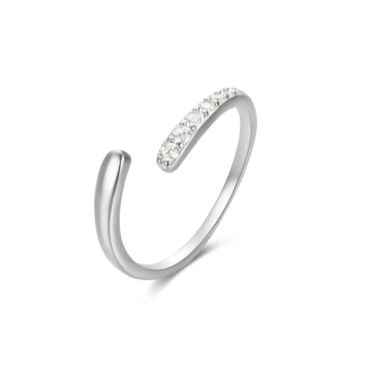 Silver open ring with small stones on a white background
