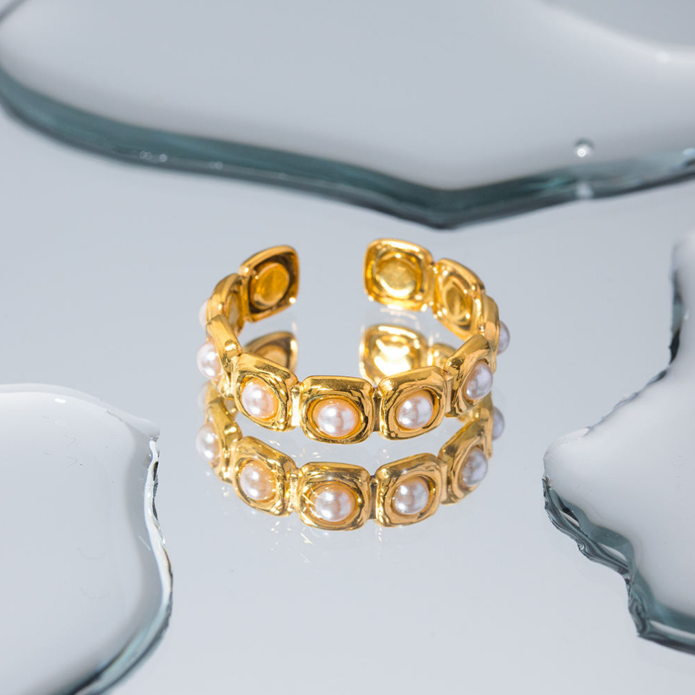 Gold ring with pearl accents