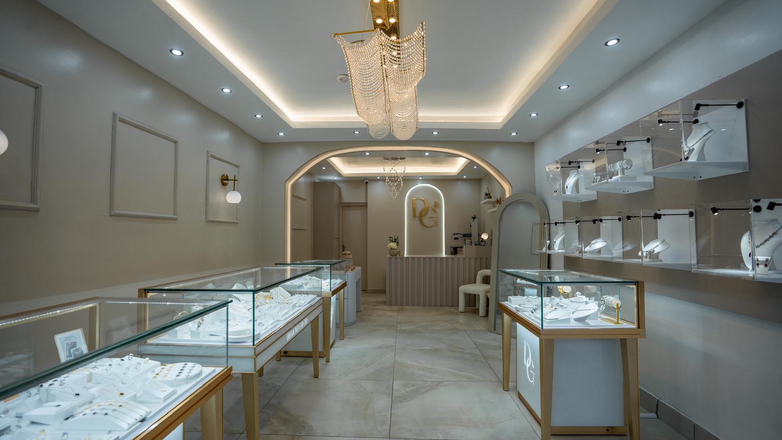 DG jewellery store interior with glass display cases and a chandelier.
