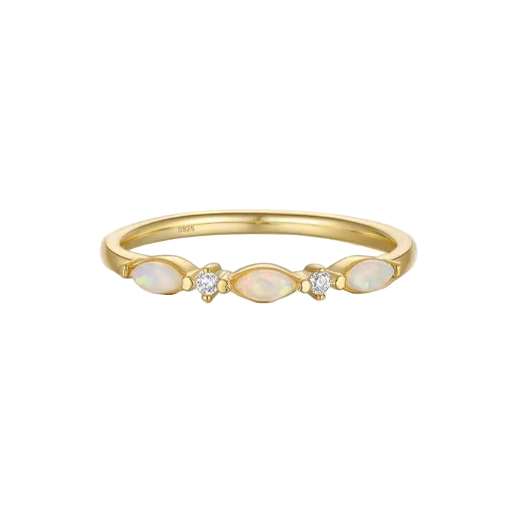 Celestia harmony stacker ring in gold with stones set on a white background.