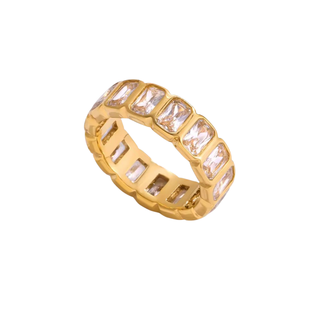 Gold ring with rectangular gemstones on a white background