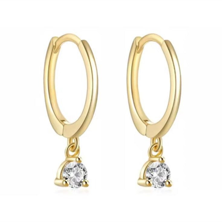 Gold hoop earrings with small round gemstones on a white background