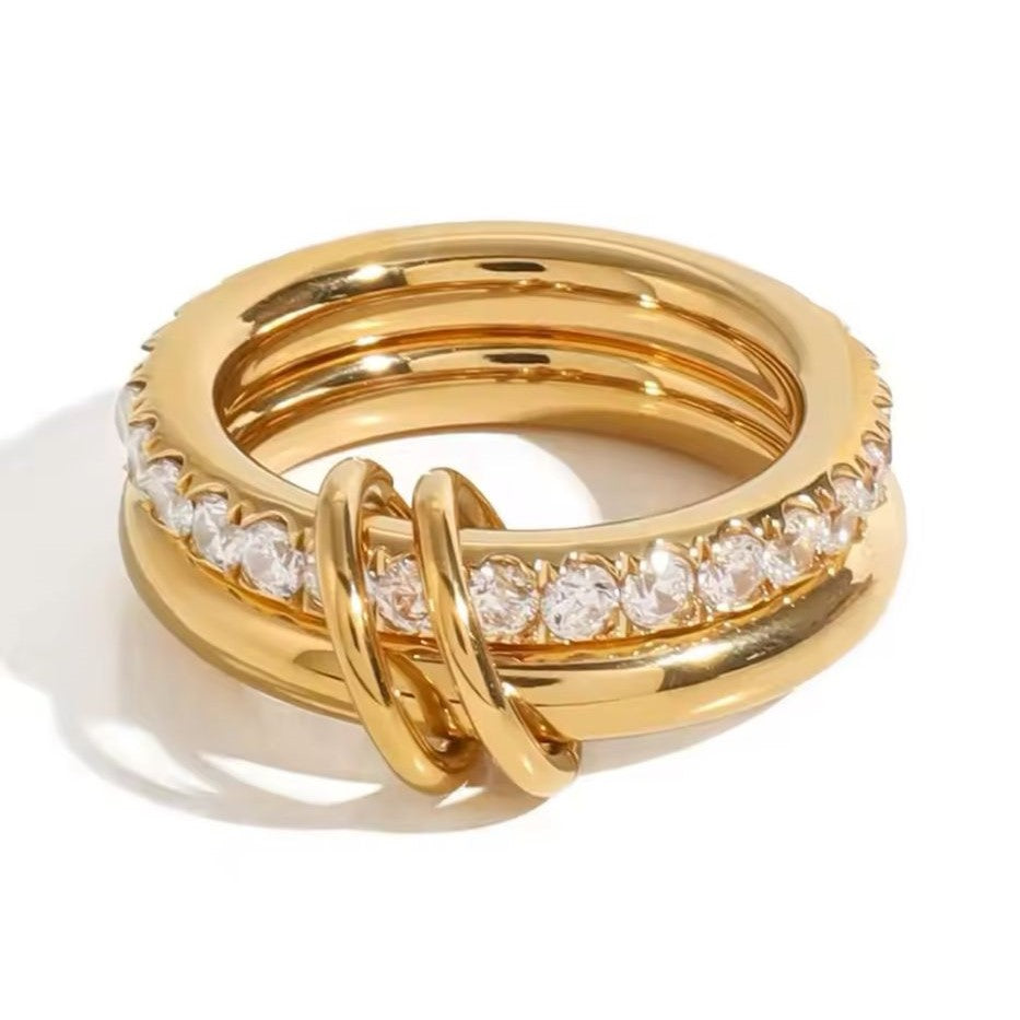 A gold-plated stainless steel double layered ring with the lower band embellished with crystals.