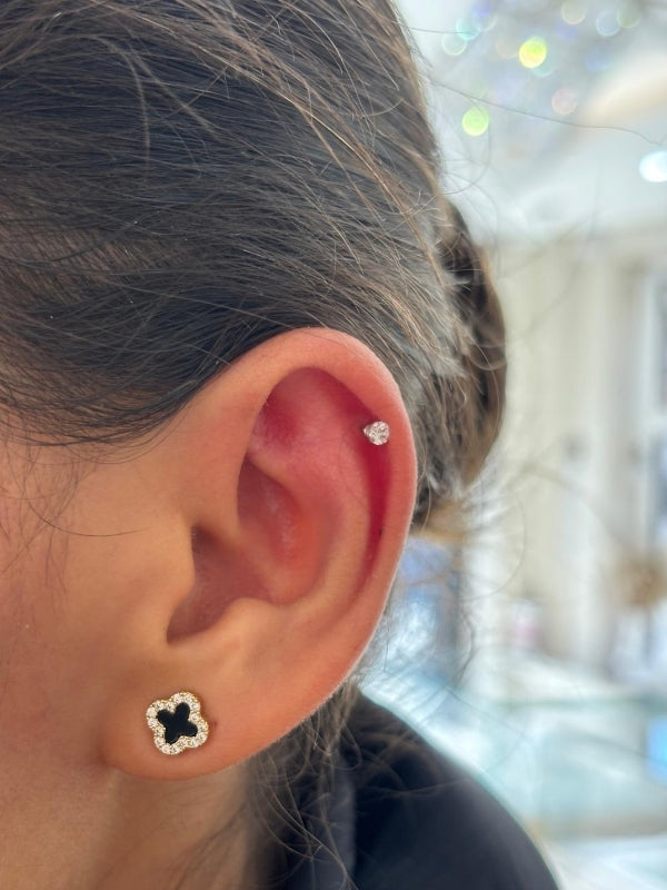 Close-up of an ear after getting ear piercing and wearing earrings from Diamond Galore Bolton