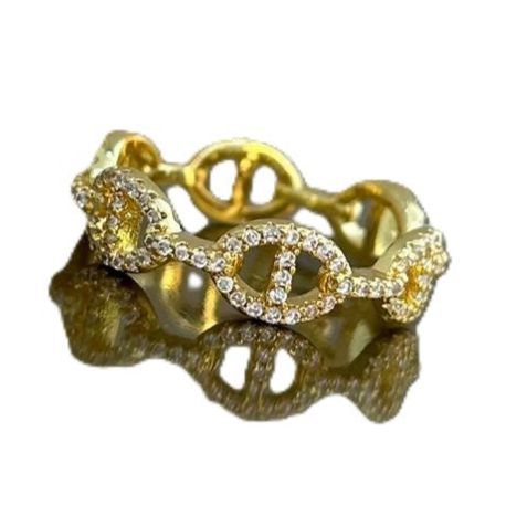 Gold ring with diamond accents against white background