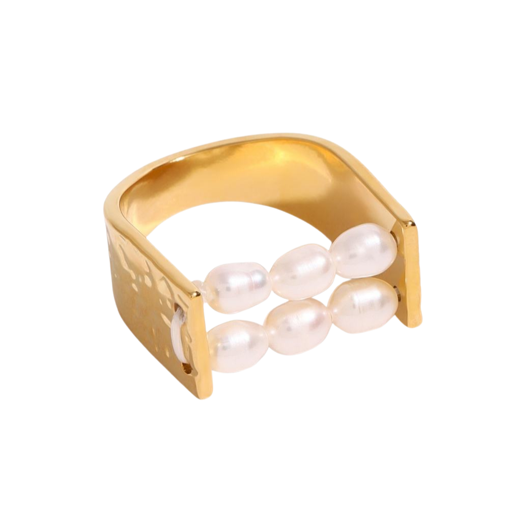 Gold ring with pearls on a white background