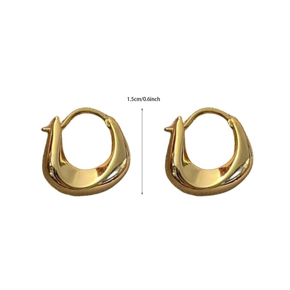 A pair of gold-colored hoop earrings with a curved design, displayed against a white background.