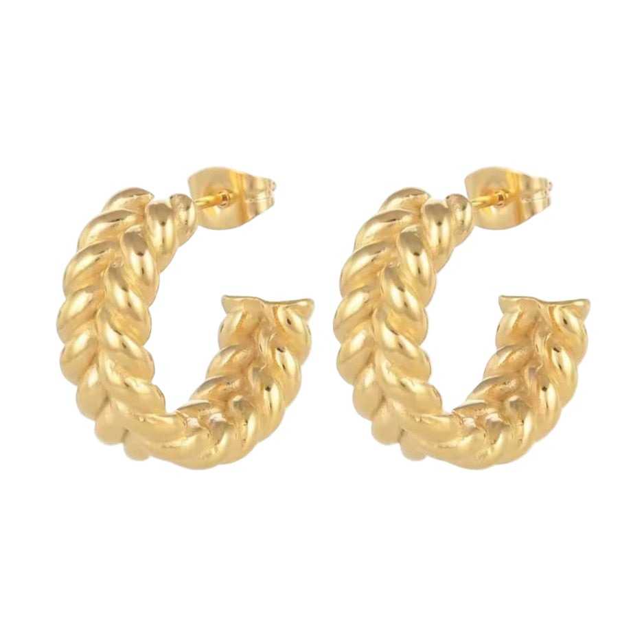Gold hoop earrings on a white background