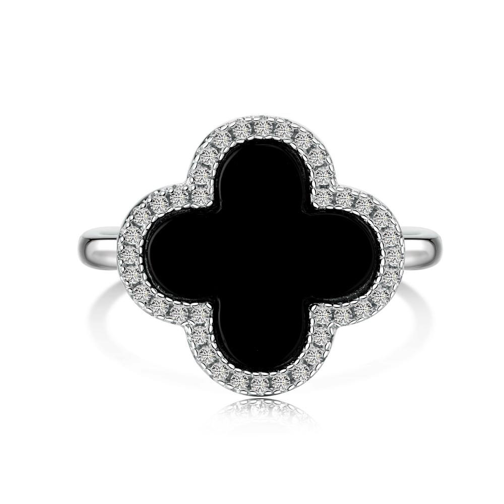 A clover-shaped ring with black shell accent, in 925 sterling silver with a rhodium plating, displayed against a white background.