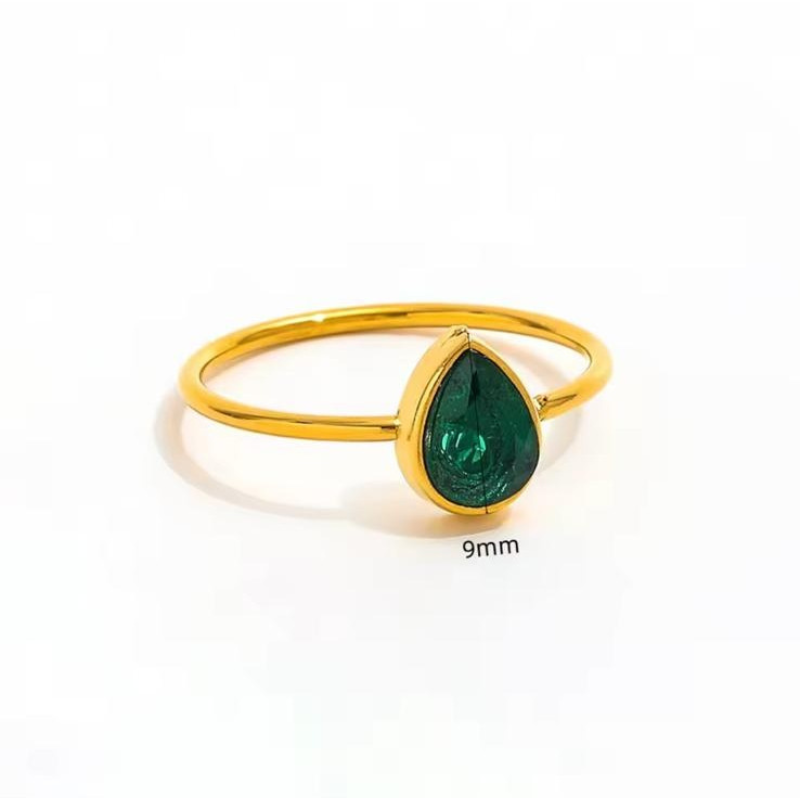 Green teardrop stone gold ring in a refined minimalist design.