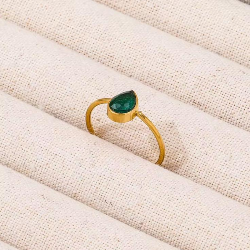 Green teardrop stone gold ring in a refined minimalist design.
