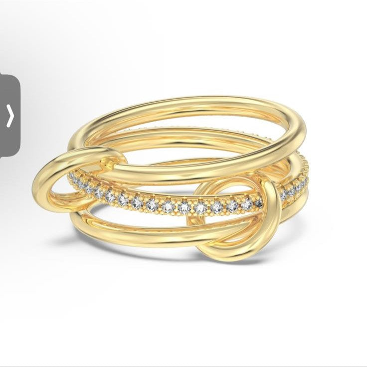 Gold ring with diamond accents on a white background