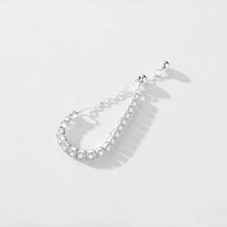 An adjustable 925 sterling silver chain ring with a series of shimmering stones set in a linked chain design.