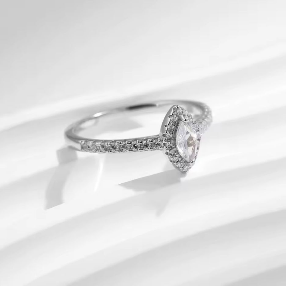 Diamond ring on a light gray background