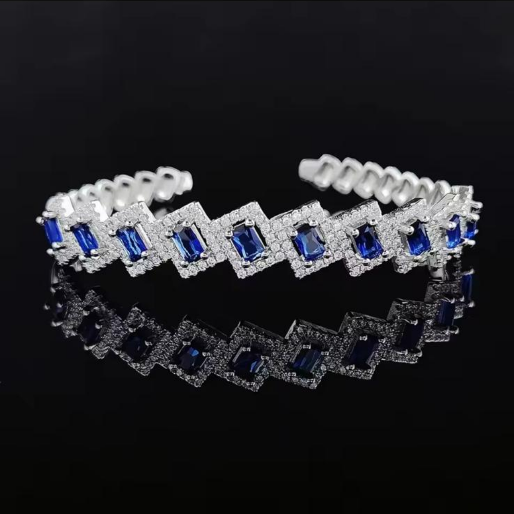 Adjustable Mayal Bangle in Blue Silver displayed over a dark background.