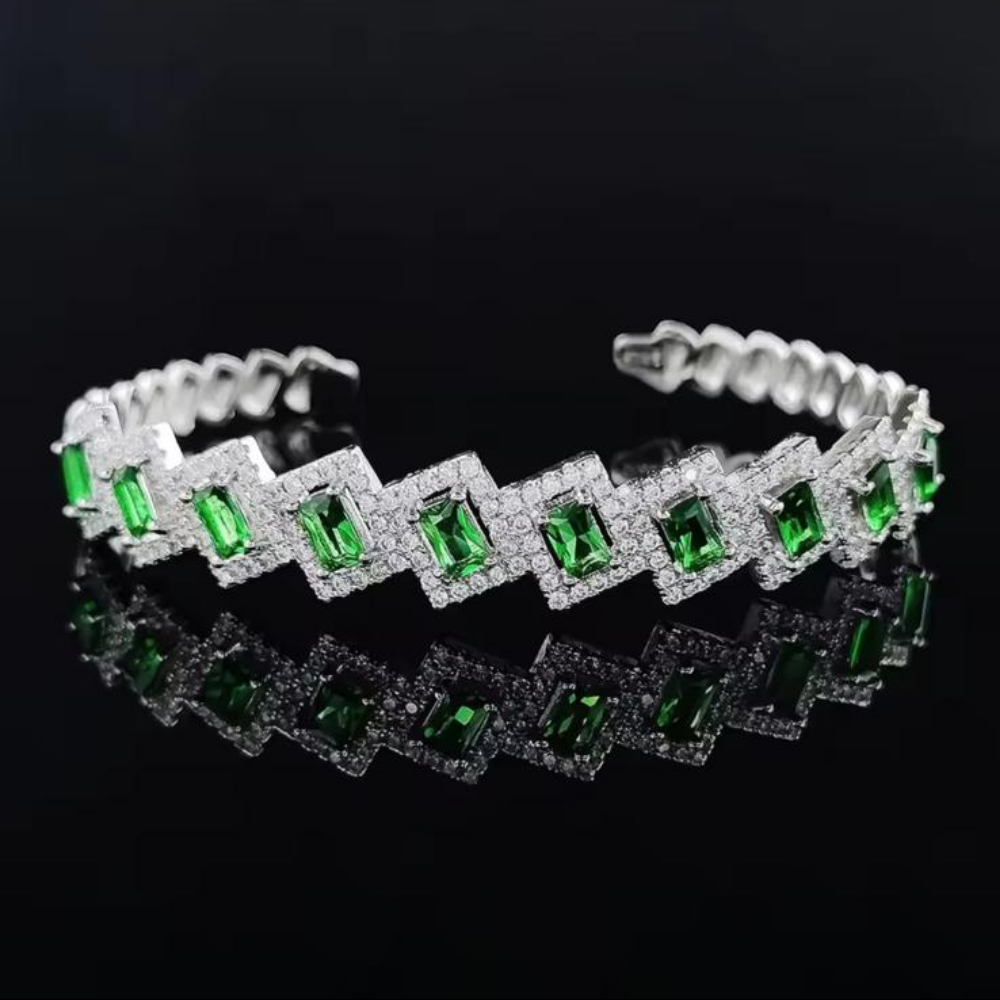 Adjustable Mayal Bangle in Green Silver displayed over a dark background.