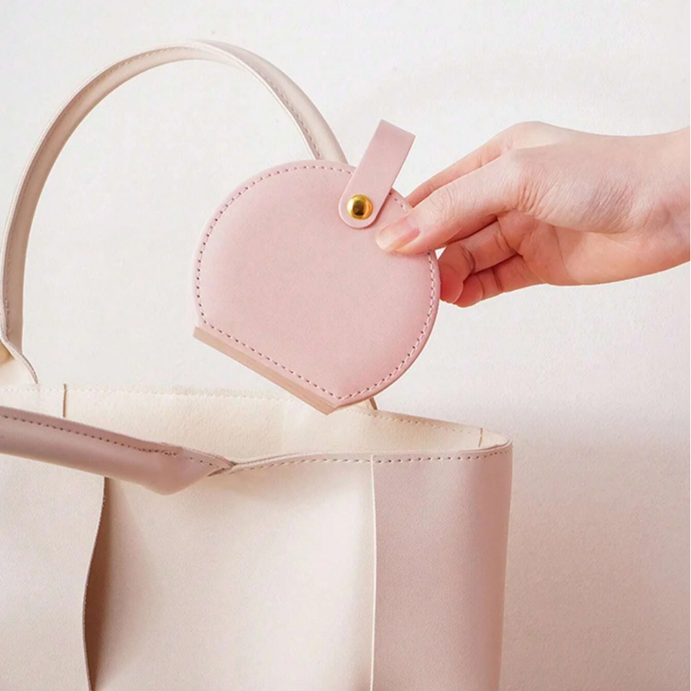 Women holding Mini Round Travel Jewellery Box in Pink