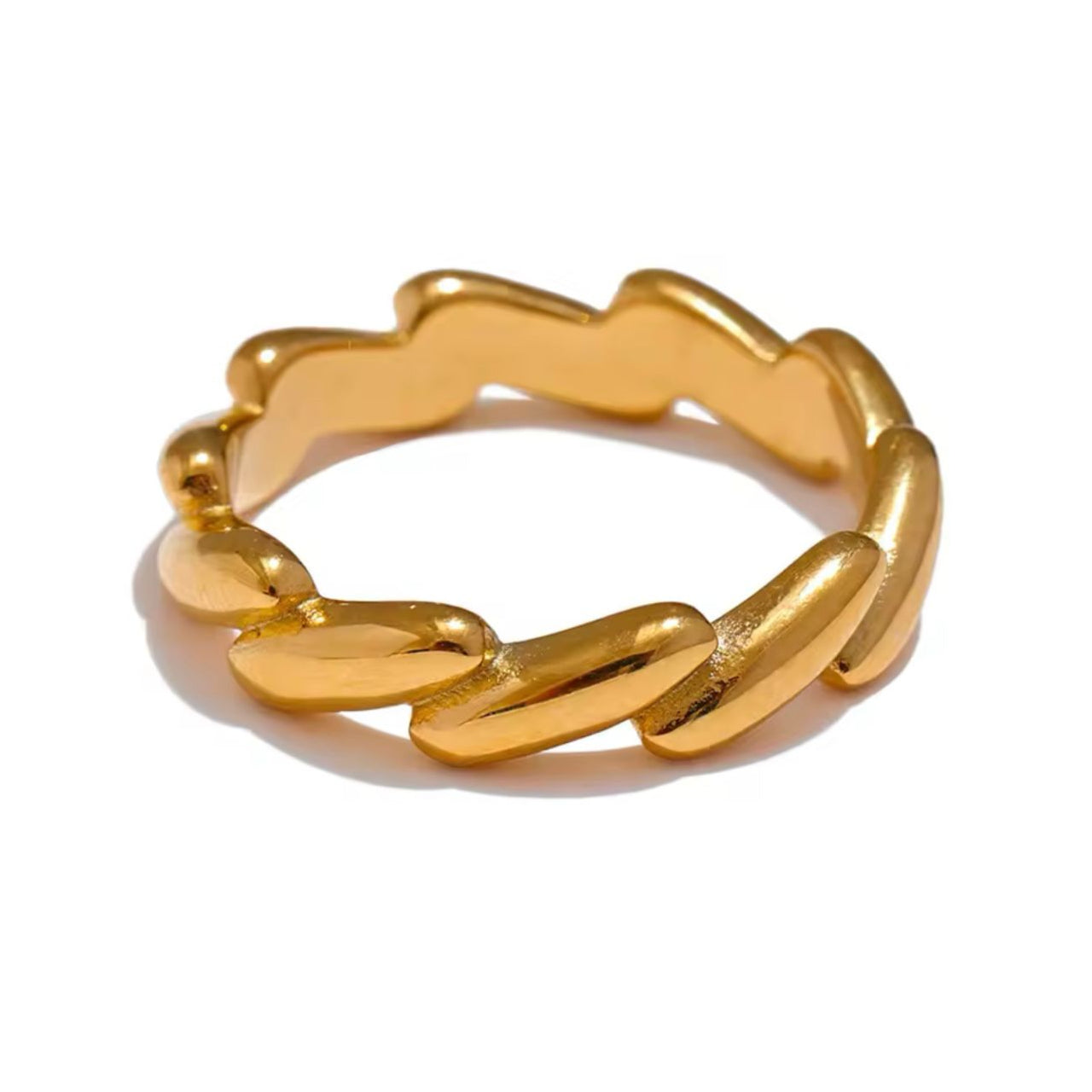 A gold-colored geometric-patterned stainless steel ring on a white background.
