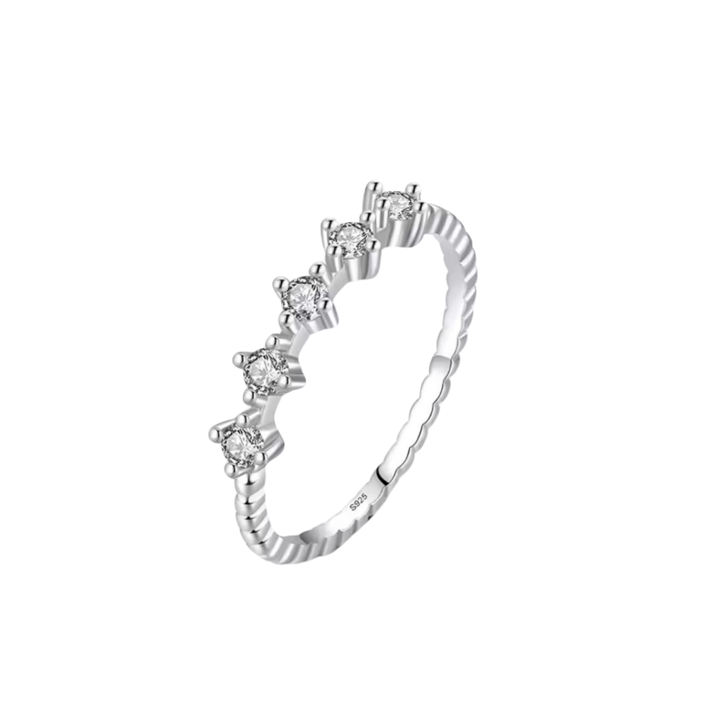 Silver ring with diamond accents on a white background
