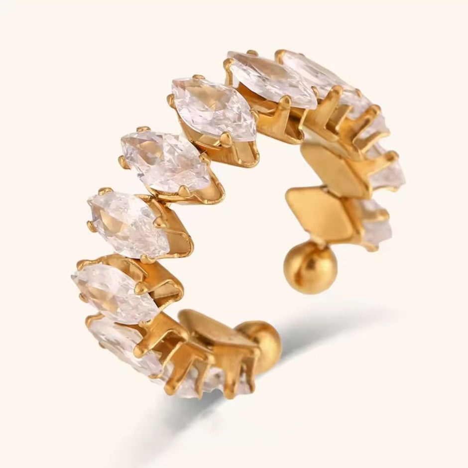 Gold ring with clear stones on a white background