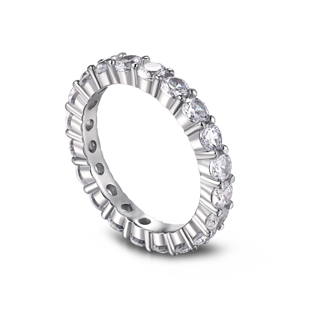 A silver band eternity ring with round-cut cubic zirconia stones set around its entire circumference.
