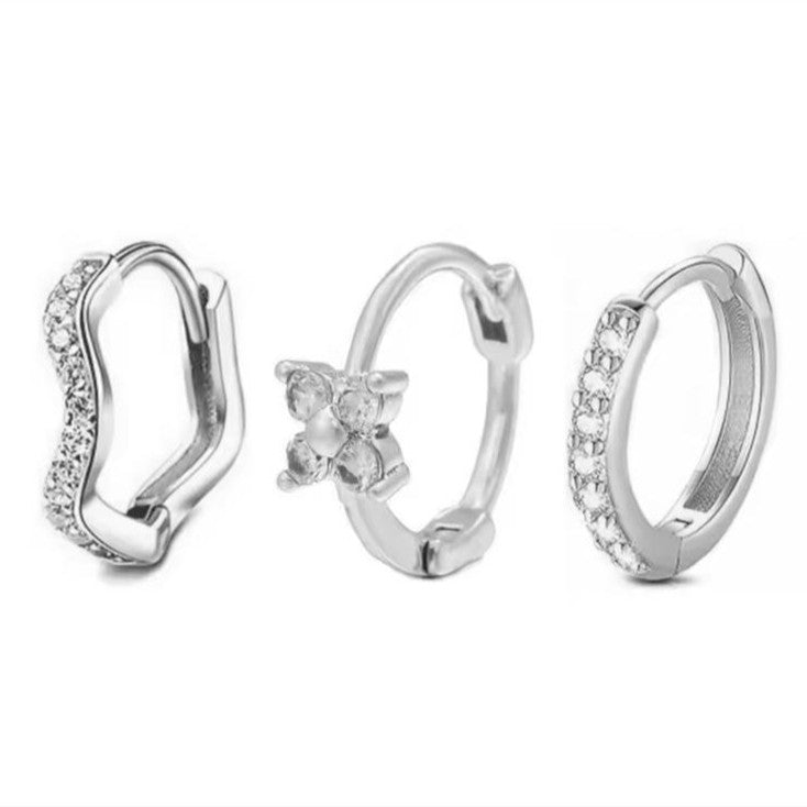 Set of 3 Huggie Hoop Earrings in Silver on a white background