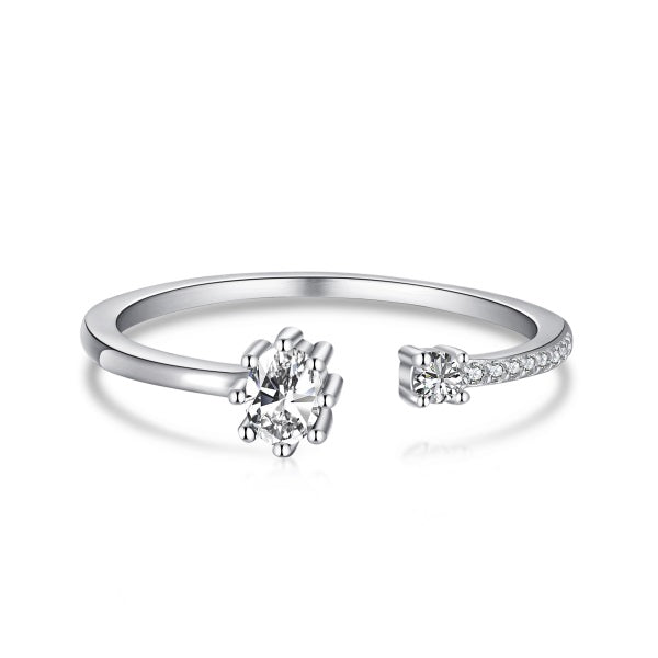 Adjustable silver ring with a clear, ornate design around the central stone.