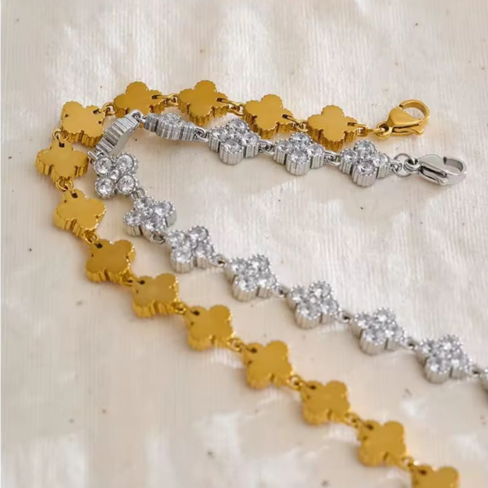 Stainless Steel Crystal Flower Bracelet in Gold & Silver displayed over a beige background