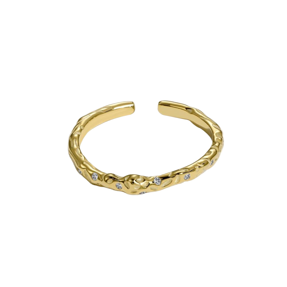 A gold-colored adjustable ring with a textured surface and embedded transparent stones.