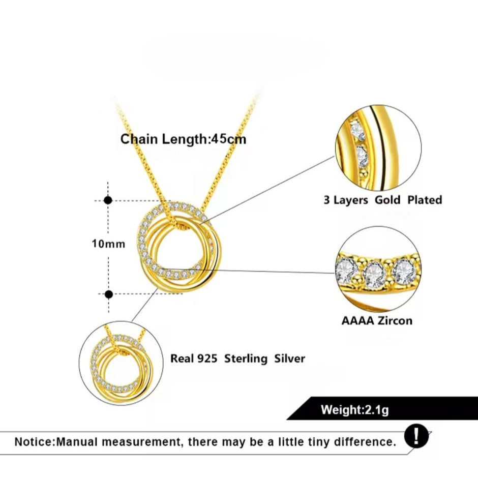 Gold necklace with 3 small rings with detailed specifications on a white background