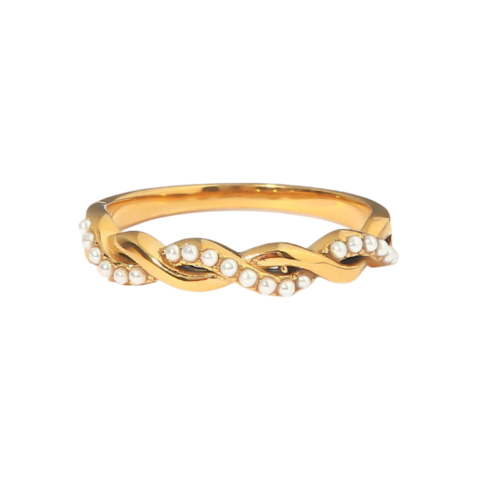Twisted gold ring with pearls on a white background