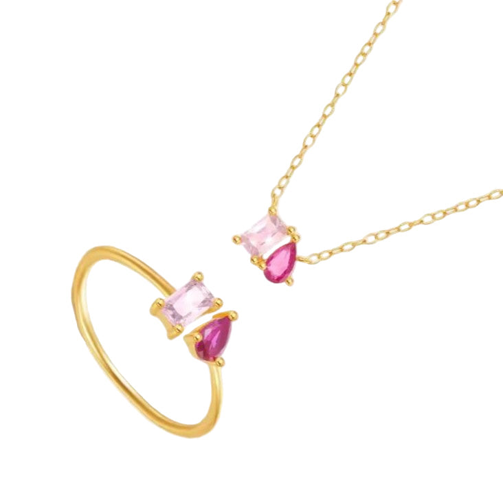 Gold ring and necklace set with pink gemstones on a white background
