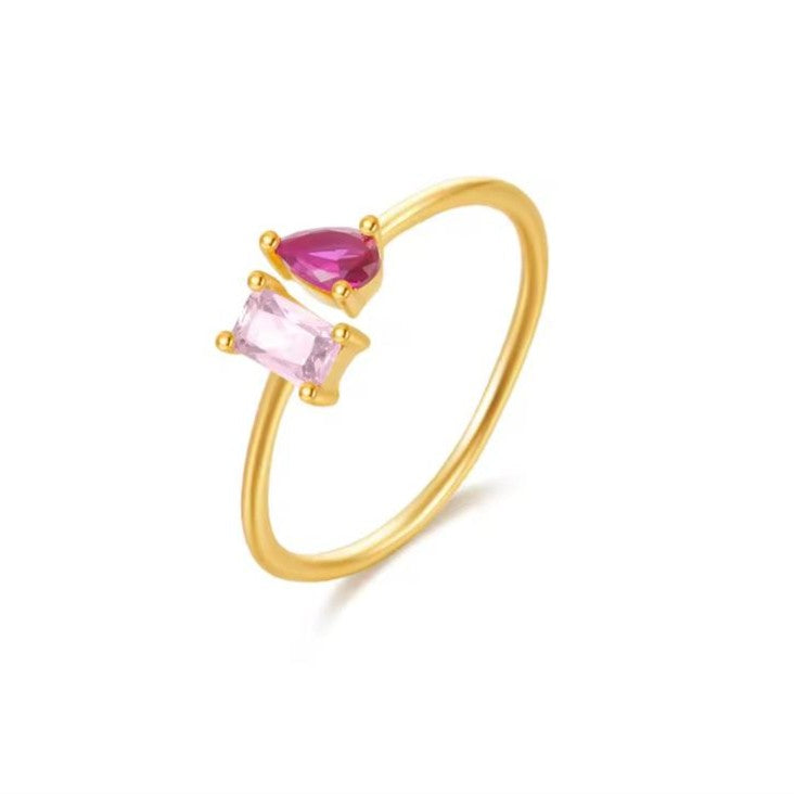 A Velvet Spark 925 Sterling Silver Gold Ring with pink gemstones, displayed on a white background.