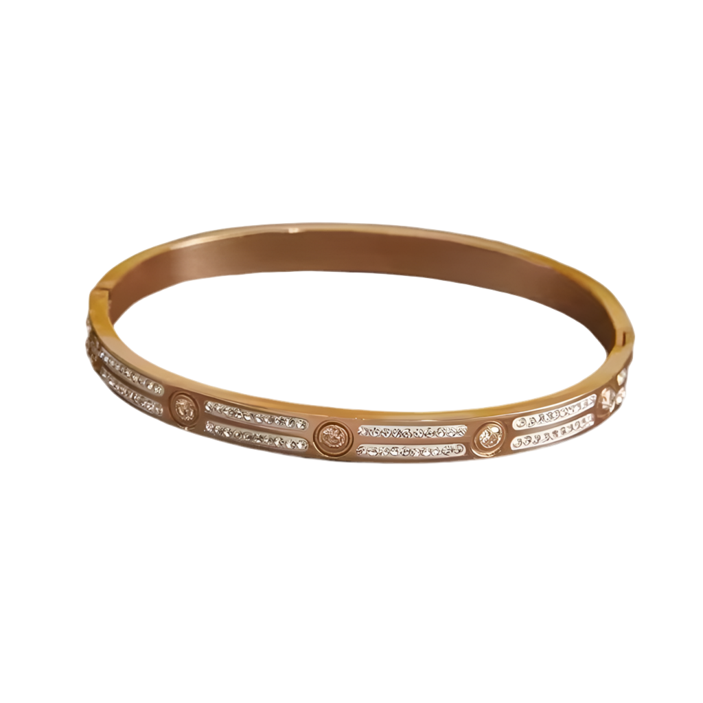 Gold bracelet with embedded stones on a white background