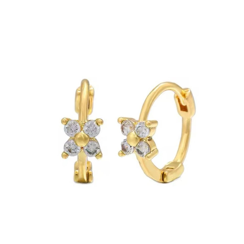 A pair of gold-colored huggie hoop earrings with a daisy design, crafted from stainless steel.
