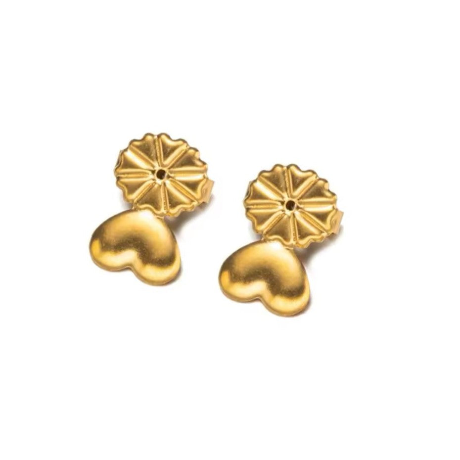 A pair of gold-colored earring lifters with a heart-shaped design, intended for use with post earrings to provide support and lift.