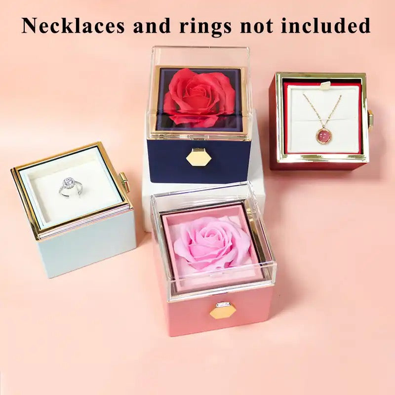 A collection of Rotatable gift boxes with preserved red, and pink rose inside, alongside ring and necklace box.