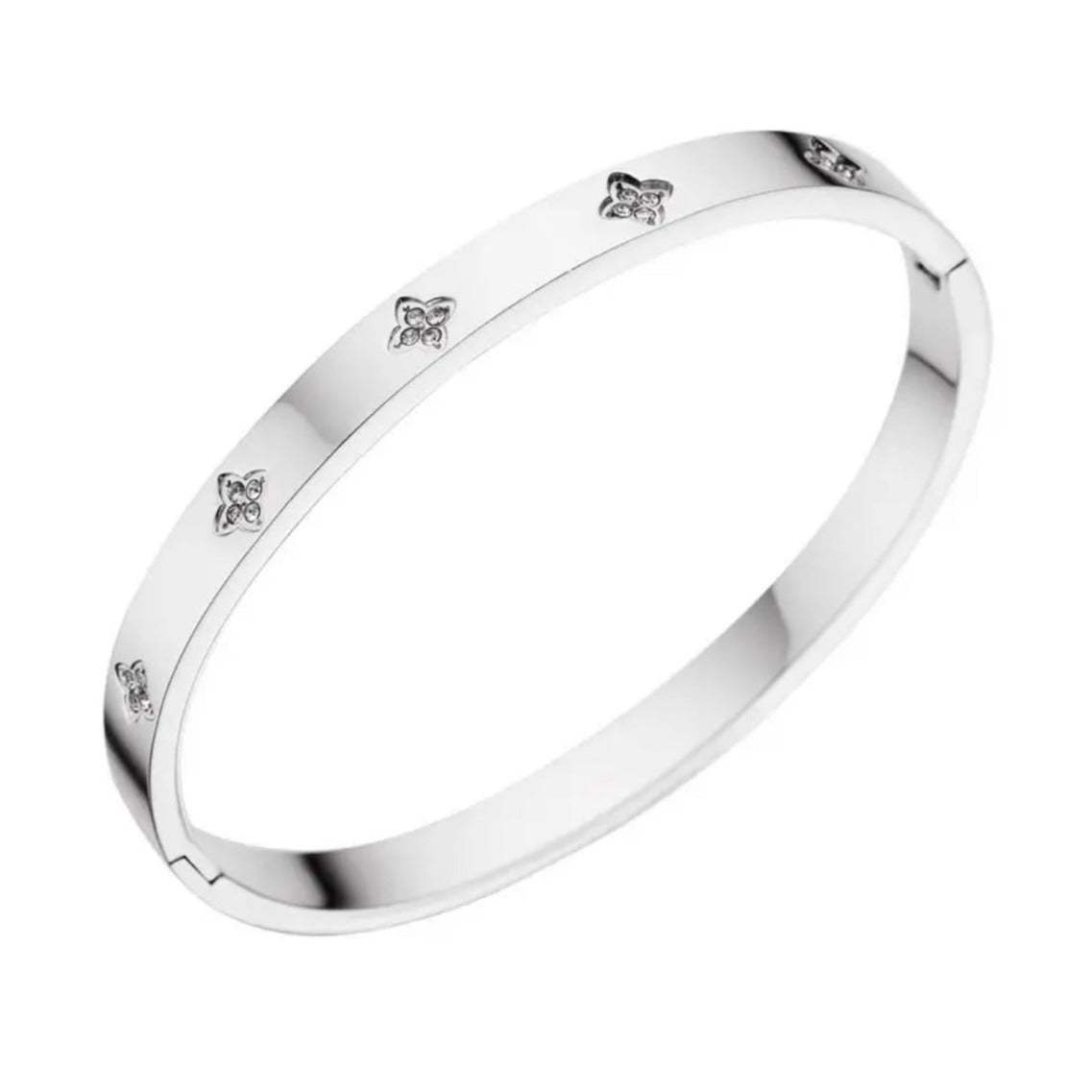 A silver stainless steel bangle bracelet with flower accents.
