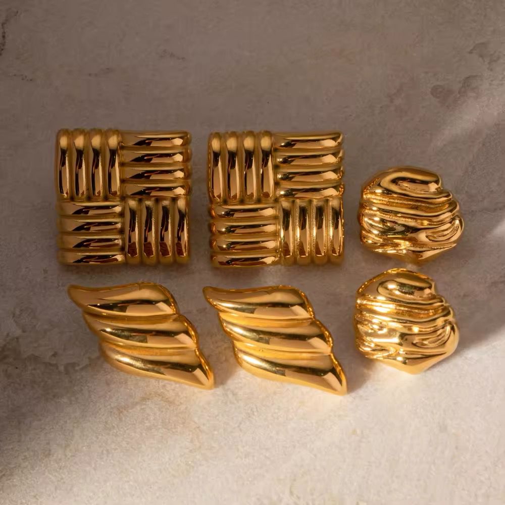Pairs of 18k gold plated stainless steel matrix stud earrings.