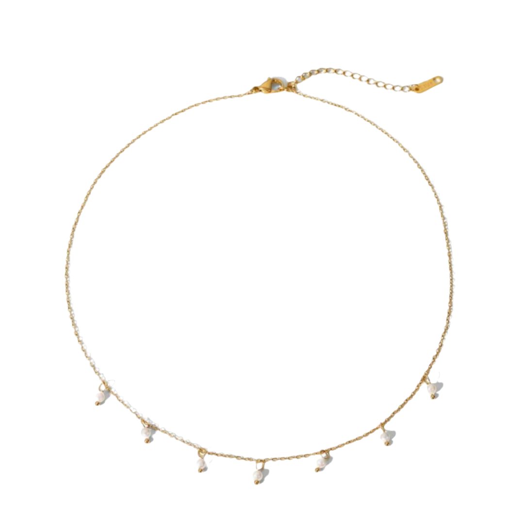 A gold-colored stainless steel necklace with faux pearl drop pendants on a white background.